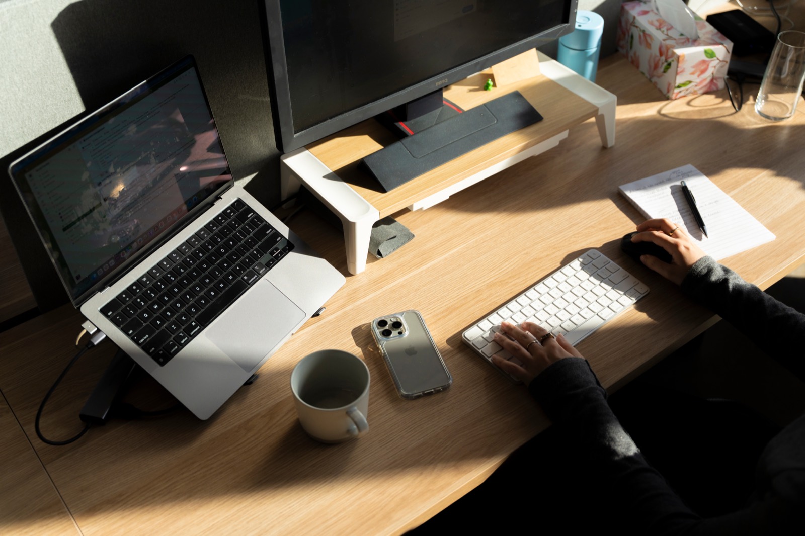 Gardeners working side by side at a shared desk