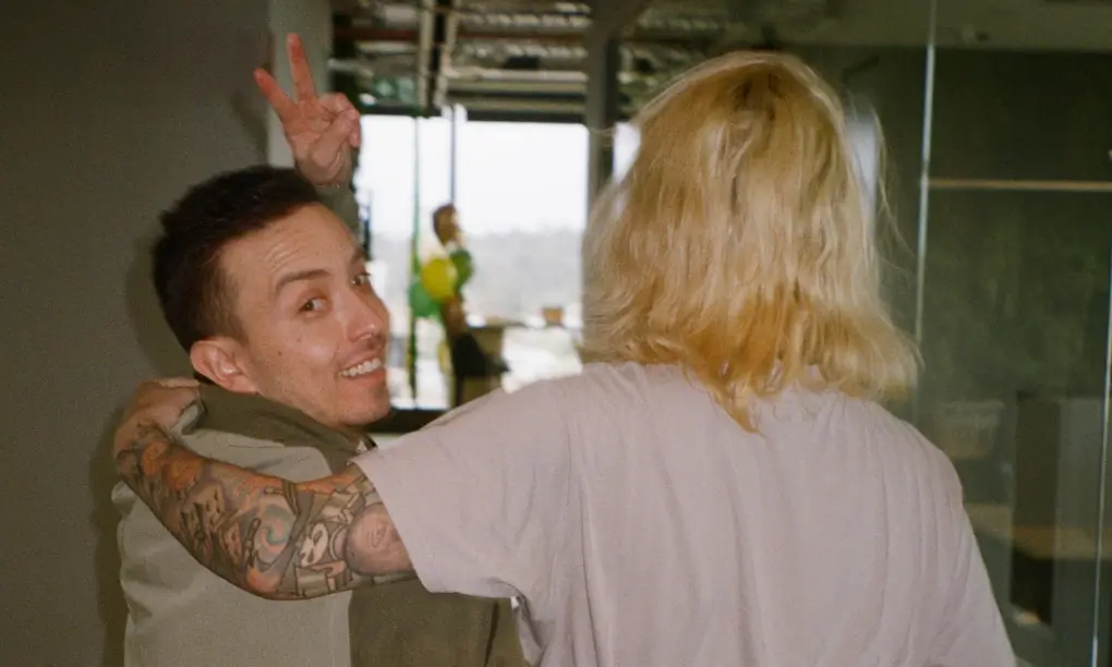A Gardener throwing a peace sign in the Melbourne office
